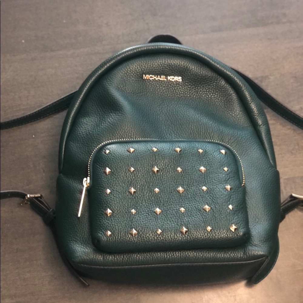 Michael Kors green “Erin” backpack.